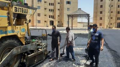 تنفيذ أعمال الأسفلت السطحي بمنطقة الإسكان القومى بالشروق