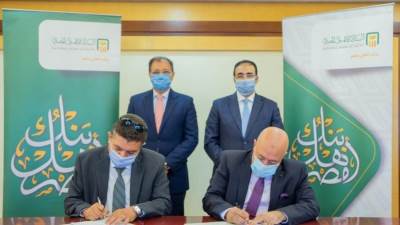 بروتوكول تعاون بين أمان للدفع الإلكتروني والبنك الأهلي لنشر 25 ألف ماكينة POS