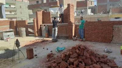 تسليم نموذج التصالح في مخالفات البناء بالأقصر