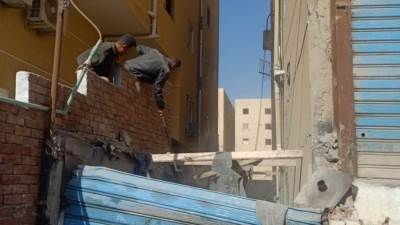 إزالة أعمال تحويل وحدات سكنية لمحلات بحدائق الاهرام بالجيزة 