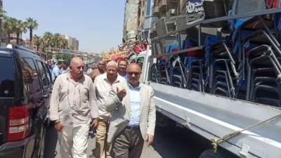 حملات مكبرة بالجيزة لتحسين حالة النظافة ومنع التعديات للمحال والمطاعم بشارع الملك فيصل