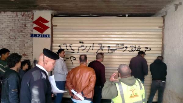 حملات حاسمة بمدينة الشيخ زايد لتنفيذ 12 قرار غلق وتشميع للمحال والوحدات المخالفة